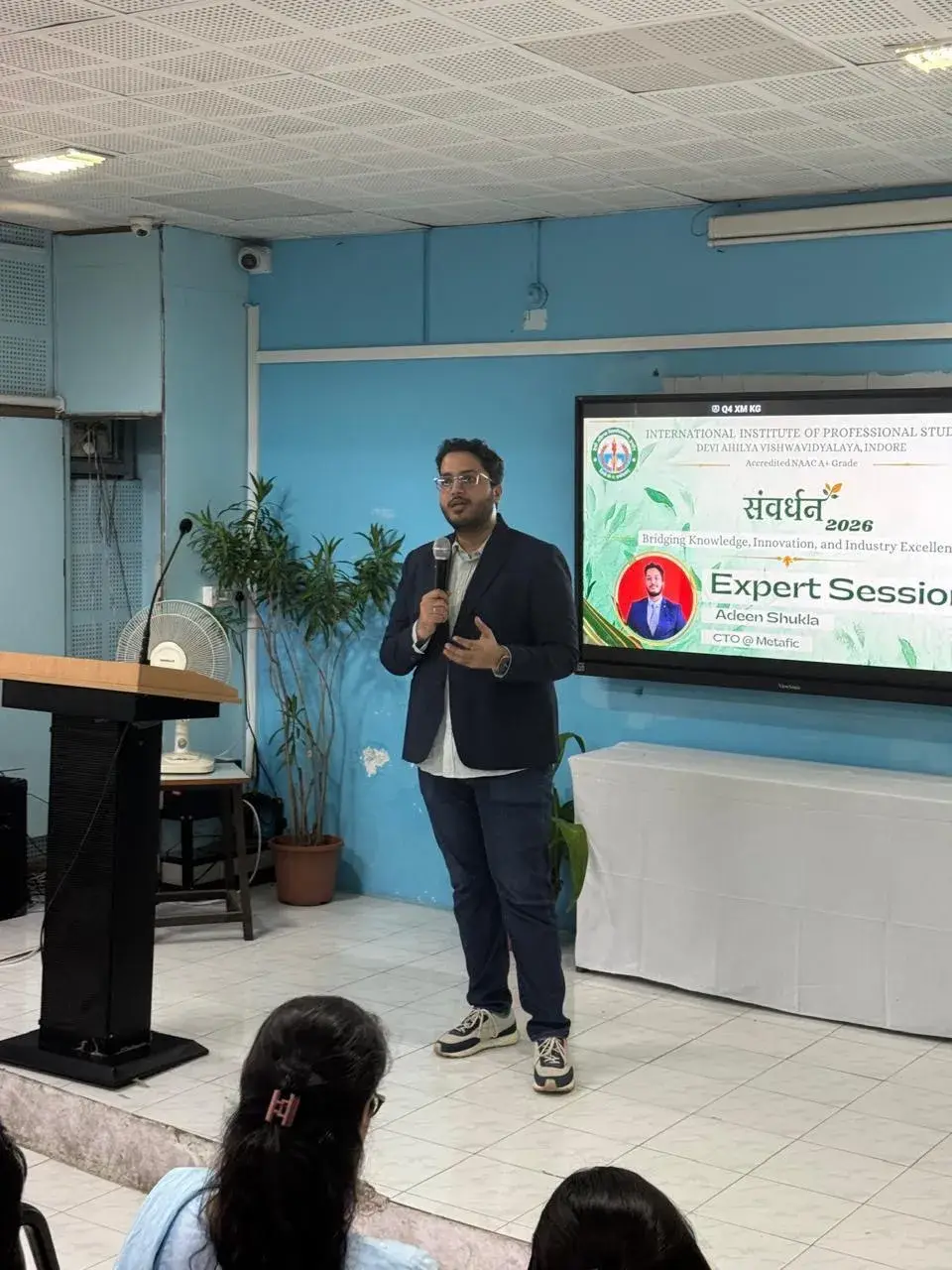 Adeen speaking at an expert session in 2026